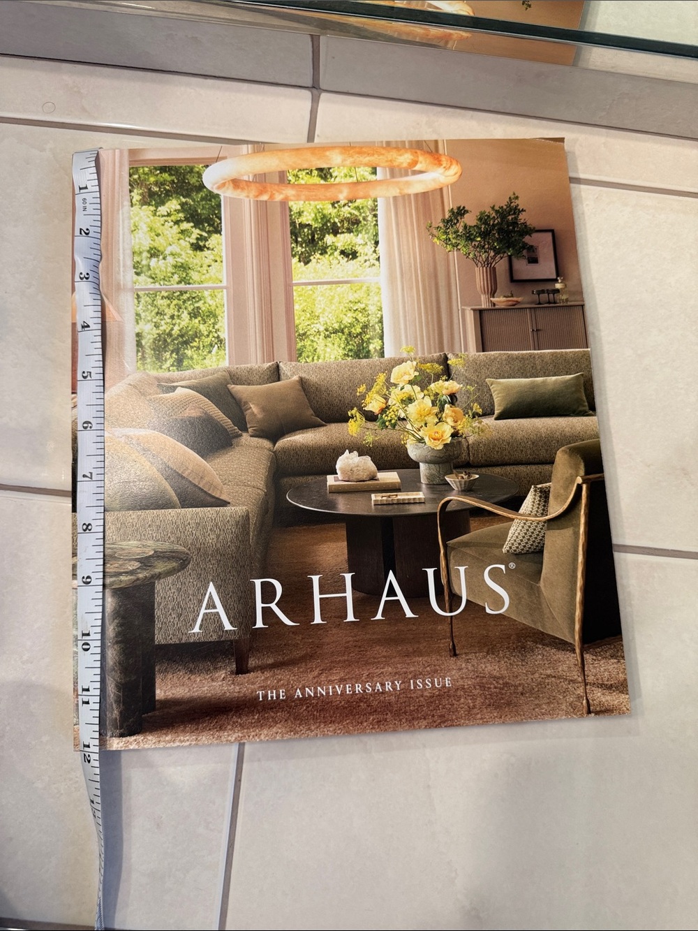 Arhaus Anniversary Coffee Table Book in Cream and Tan